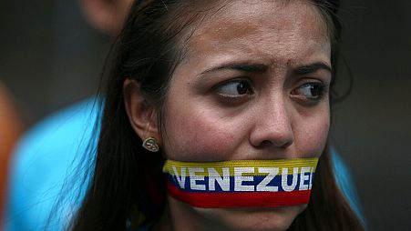 Image d'une électrice vénézuélienne lors d'une manifestation contre le gouvernement de Nicolas Maduro.