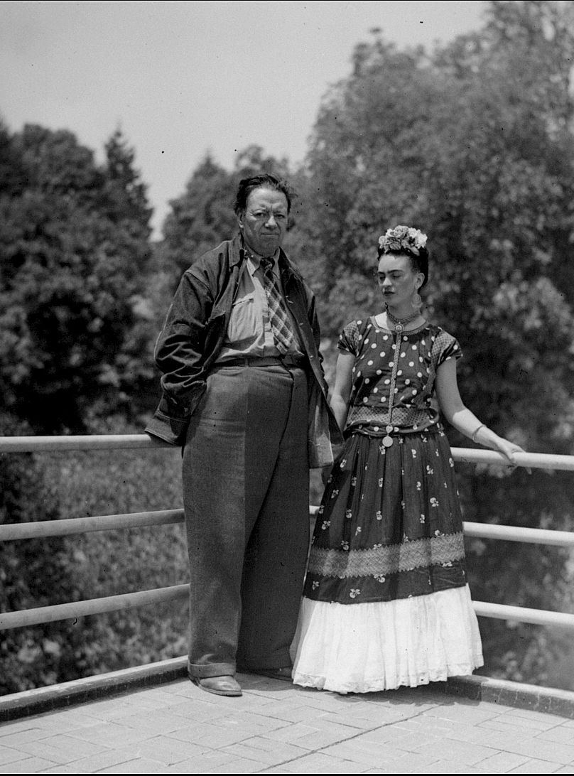 Mexican muralist Diego Rivera and Frida Kahlo photographed on a balcony at their home in Mexico City, 13 April 1939.