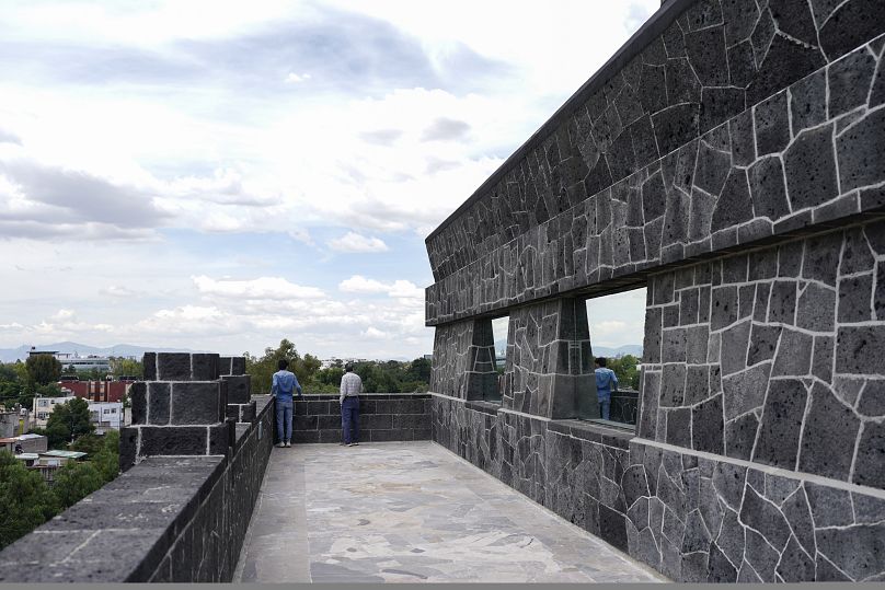 Visitors look out from the exterior of the Anahuacalli Museum in Mexico City, Tuesday, 20 August 2024.