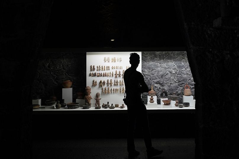 A visitor looks at pre-Hispanic ceramics on display at the Anahuacalli Museum in Mexico City.