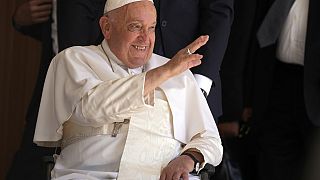 Pope Francis greets people in the Cathedral of the Immaculate Conception