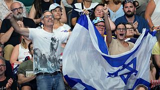 Israel fans react during the night swimming session at the 2024 Summer Olympics, Friday, Aug. 2, 2024, in Nanterre, France.