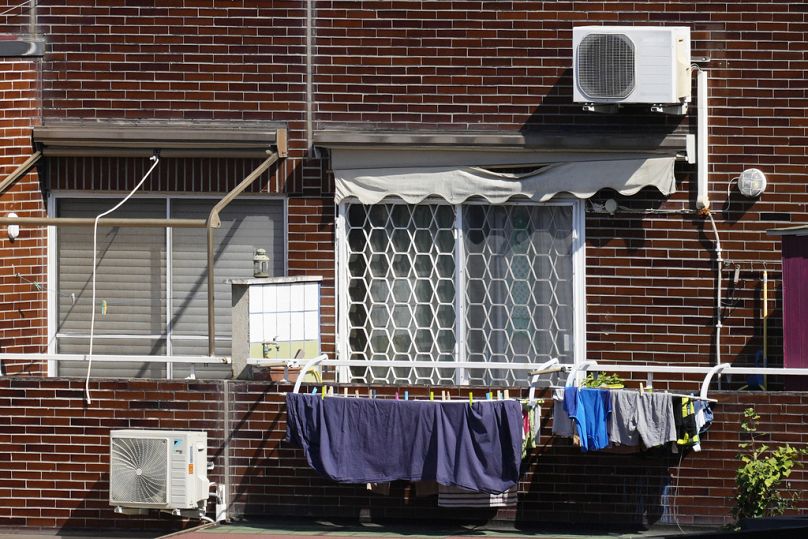 Air conditioning external units are seen on the facade of a building in Rome.