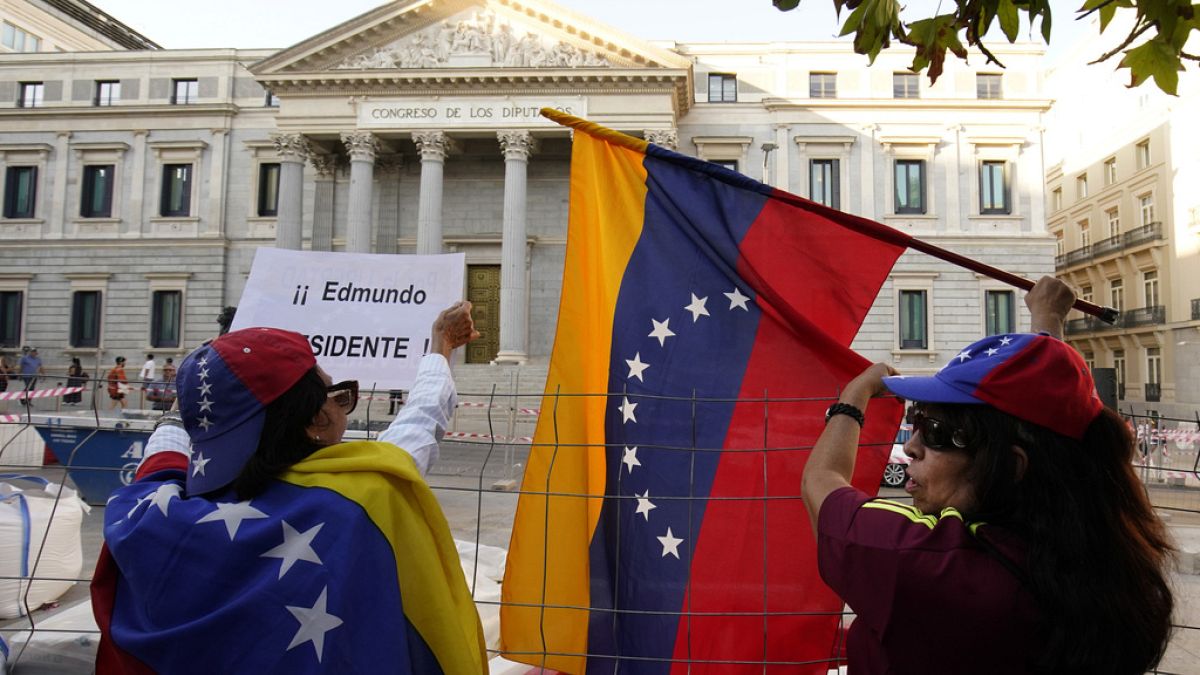 Supporters of Edmundo Gonzalez take part in a protest in Madrid, Spain, Tuesday, Sept. 10, 2024.