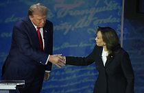 Republican presidential nominee former President Donald Trump shakes hands with Democratic presidential nominee Vice President Kamala Harris 