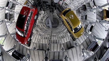 New cars readied for handover inside one of two 'car towers' at the Volkswagen car factory in Wolfsburg