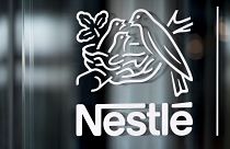 Nestle's logo is displayed on a window, during the 2018 full-year results press conference of the food and drinks giant Nestle, in Vevey, Thursday, Feb. 14, 2019. 