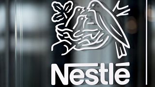 Nestle's logo is displayed on a window, during the 2018 full-year results press conference of the food and drinks giant Nestle, in Vevey, Thursday, Feb. 14, 2019. 