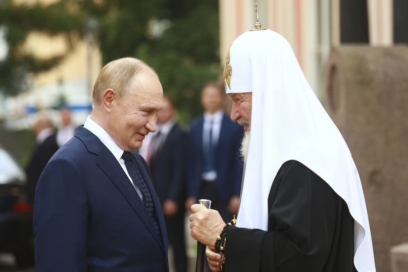 Russian President Vladimir Putin, left, and Russian Orthodox Patriarch Kirill, right