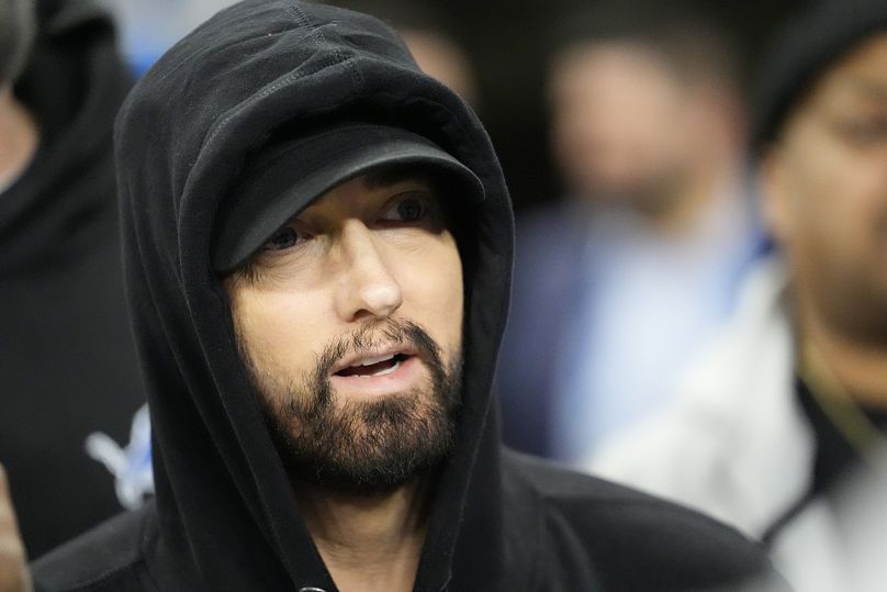 Eminem is seen during pregame of an NFL wild-card playoff football game, 14 January 2024, in Detroit. 