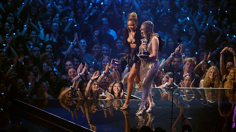 Tinashe, left, presents the best new artist award to Chappell Roan during the MTV Video Music Awards