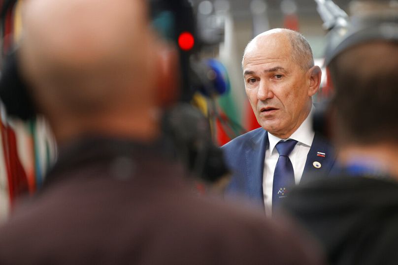 FILE: Slovenian Prime Minister Janez Janša talks to journalists as he arrives for an EU summit at the European Council building in Brussels, 25 June 2021