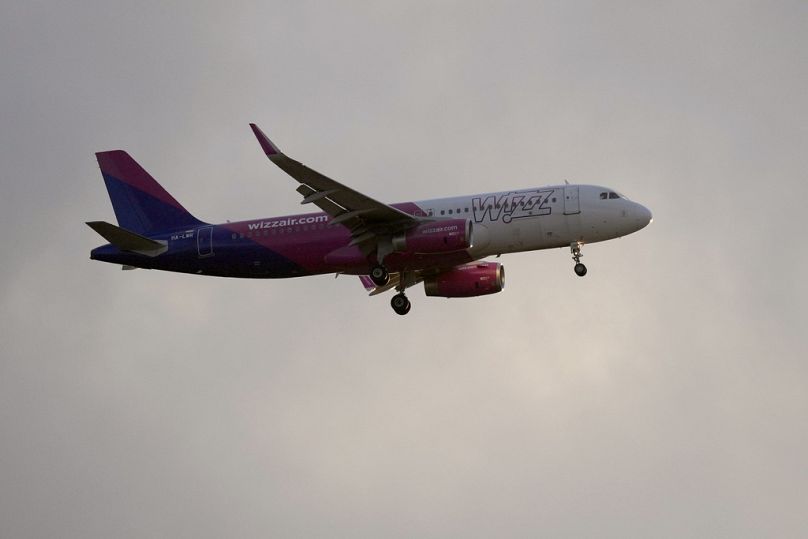 Short haul Wizz: A Wizz Air Airbus A320 approaches for landing in Lisbon in July