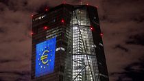 A light installation is projected onto the building of the European Central Bank in Frankfurt, Germany,