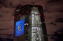 A light installation is projected onto the building of the European Central Bank in Frankfurt, Germany,