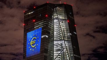 A light installation is projected onto the building of the European Central Bank in Frankfurt, Germany,