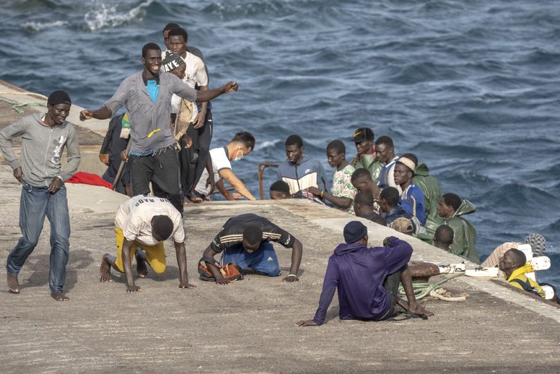 Migrants react as they arrive at the port in La Restinga on the Canary island of El Hierro, Spain, on, Aug. 19, 2024.