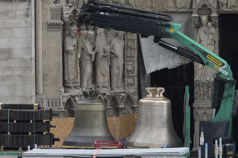 A truck carrying bells is parked outside Notre-Dame de Paris cathedral, in Paris, Thursday, Sept. 12, 204. 