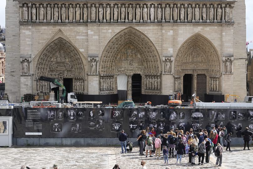 A truck carrying bells is parked outside Notre-Dame de Paris cathedral, in Paris, Thursday, Sept. 12, 2024