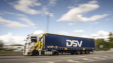 A truck drives outside the Logistics center of the transport company DSV in Hedehusene, Denmark. 12 September 2024.