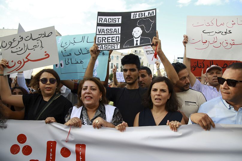 Tunisians take part in a protest against President Kais Saied ahead of the upcoming presidential elections, September 13, 2024