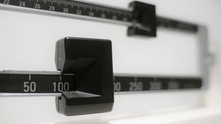 A closeup of a beam scale is shown.
