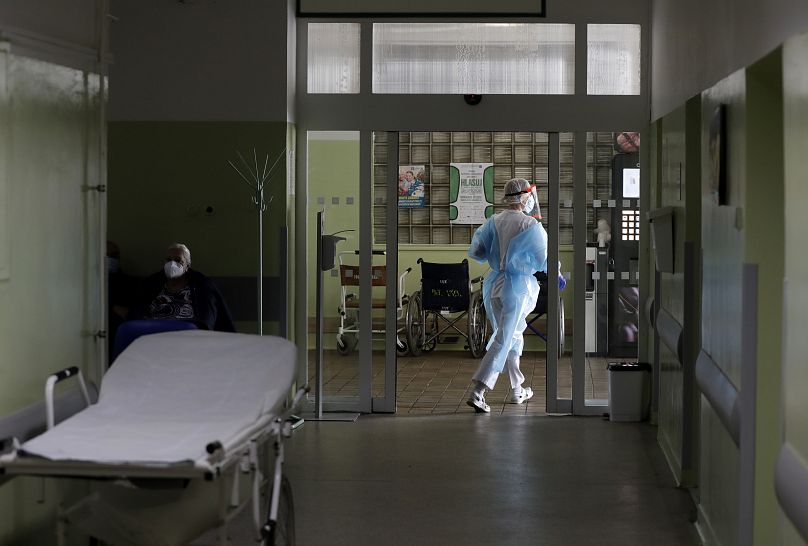 A health care worker walks in hallway at a hospital in Kyjov, Czech Republic.