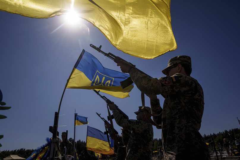 Honour guards shoot into the air during the funeral ceremony of six Ukrainian servicemen killed in a Russian rocket attack at a Ukrainian military academy, September 7, 2024