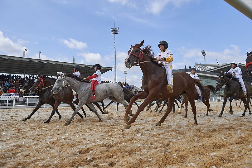 Competitors ride horses at the World Nomad Games