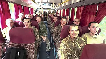 Russian soldiers captured in the Kursk region drive in a bus after being released in a prisoners swap between Russia and Ukraine