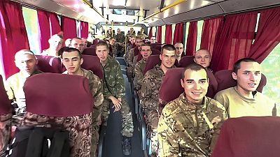 Russian soldiers captured in the Kursk region drive in a bus after being released in a prisoners swap between Russia and Ukraine