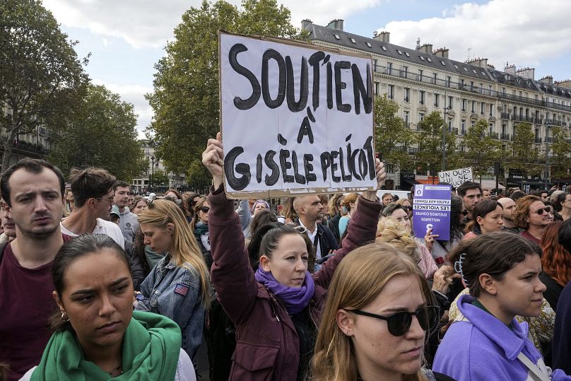 People take part in a gathering in support of 71-year-old Gisèle Pélicot who was allegedly drugged by her ex-husband and raped by dozens of men, September 14, 2024 