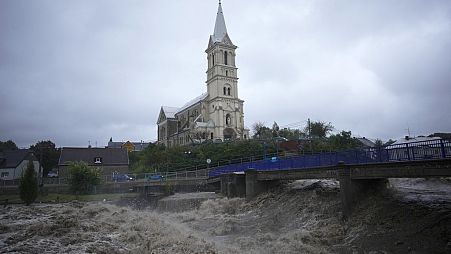 The Bela River flows past a church during floods in Mikulovice, Czech Republic, Saturday, Sept. 14, 2024