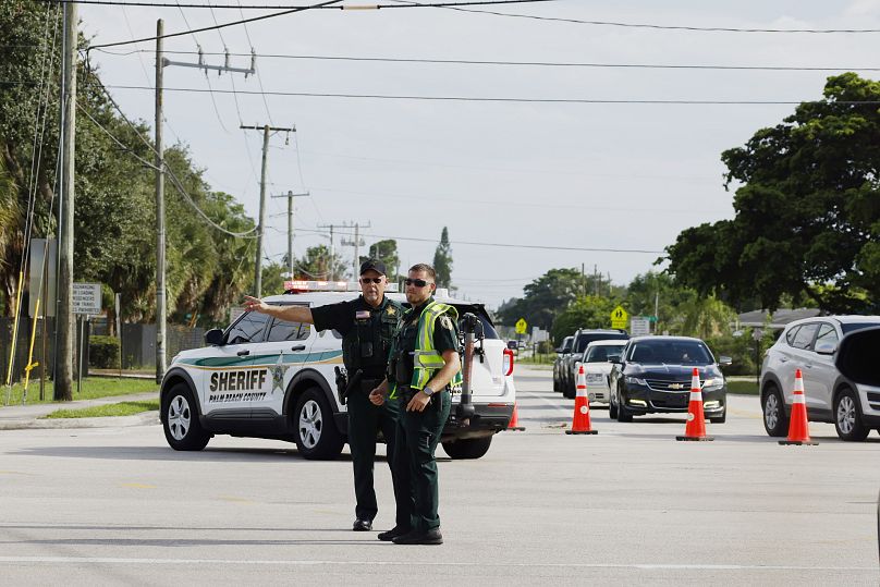 Police officers direct traffic near Trump International Golf Club in West Palm Beach, September 15, 2024