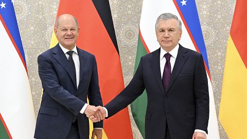 Uzbekistan's President Shavkat Mirziyoyev, right, and German Chancellor Olaf Scholz pose for a photo prior to their talks in Samarkand, September 15, 2024