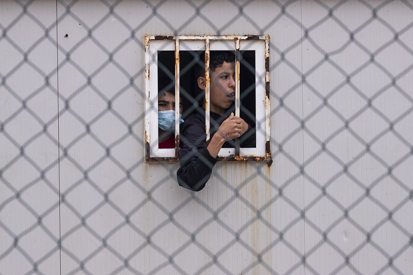 Children who crossed into Spain are seen inside a temporary shelter for unaccompanied minors in the enclave of Ceuta, May 20, 2021