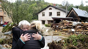 A resident hugs with her relative after being evacuated from her flooded house in Jesenik, Czech Republic, Sunday, Sept. 15, 2024.