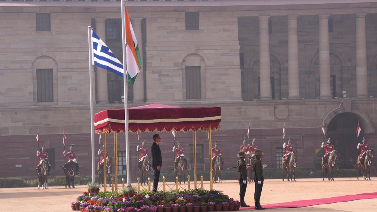 Greece's Prime Minister Kyriakos Mitsotakis inspects a joint military guard of honor during a ceremonial reception in New Delhi, India, Wednesday, Feb. 21, 2024. 