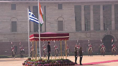 Greece's Prime Minister Kyriakos Mitsotakis inspects a joint military guard of honor during a ceremonial reception in New Delhi, India, Wednesday, Feb. 21, 2024. 