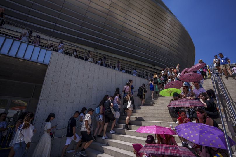 Taylor Swift fans queue to enter Madrid's Santiago Bernabeu stadium in May 2024.