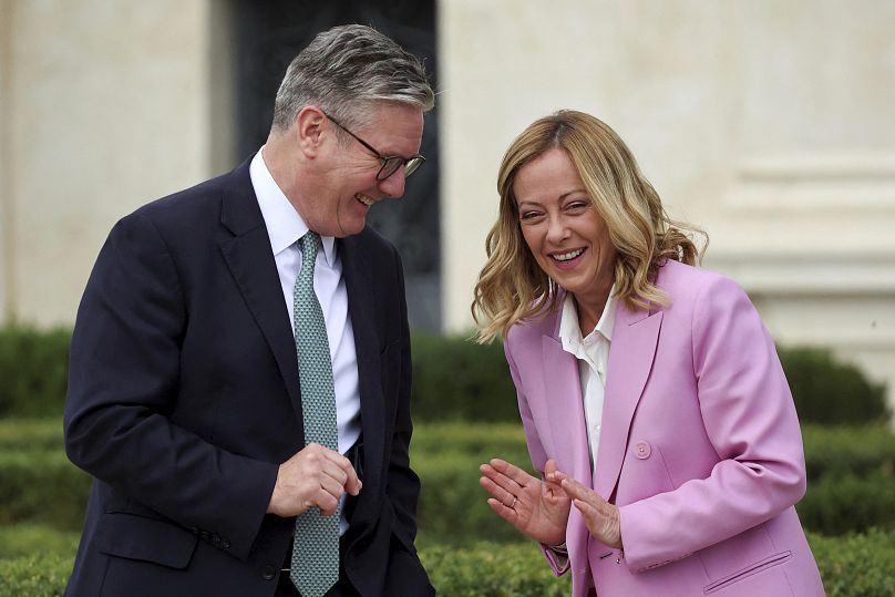 Italian Prime Minister Giorgia Meloni and British Prime Minister Keir Starmer share a laugh on the occasion of their meeting at Villa Doria Pamphilj in Rome.