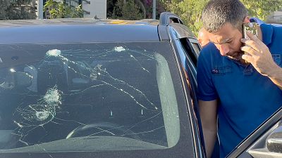 A police officer inspects a car in which a hand-held pager exploded, in Beirut, 17 September 2024