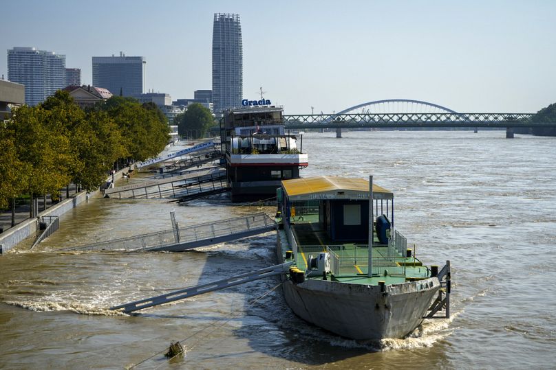 Gangways of moored boats are submerged in the Danube river in Bratislava, Slovakia.