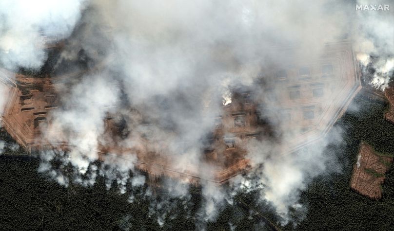 General view of the aftermath of a large series of explosion on an ammunition depot in Toropets, Russia.