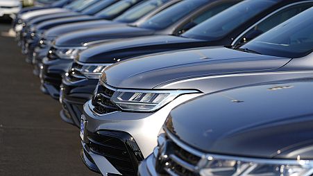 A long row of unsold 2024 Tiguan utility vehicles are shown Sunday, July 28, 2024, at a Volkswagen dealership in Denver. 