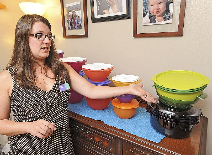 Cristina Prince, a Severna Park Elementary School teacher and a Tupperware consultant, shows off some of her merchandise on Aug. 18, 2011