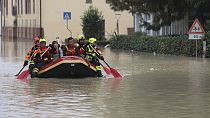 Firefighters use a dingy boat to evacuate civilians after flooding in Faenza, in the region of Emilia Romagna, Italy, Thursday, Sept. 19, 2024