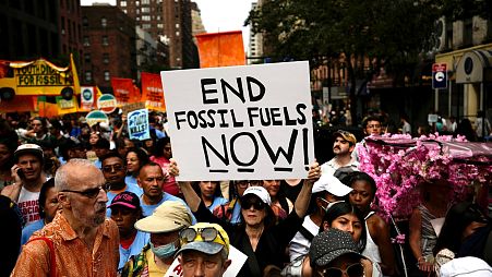 Climate activists attend a rally to end fossil fuels, in New York, Sept. 17, 2023.