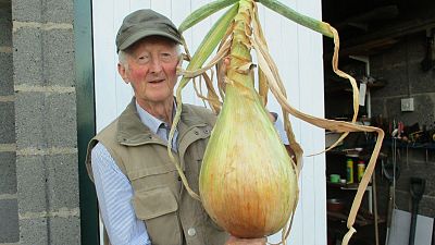 Peter with one of his impressive giant vegetables.