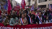 Demonstrators take part in a protest against the new French Prime Minister Michel Barnier and the government, in Paris, France, Saturday, Sept. 21, 2024.